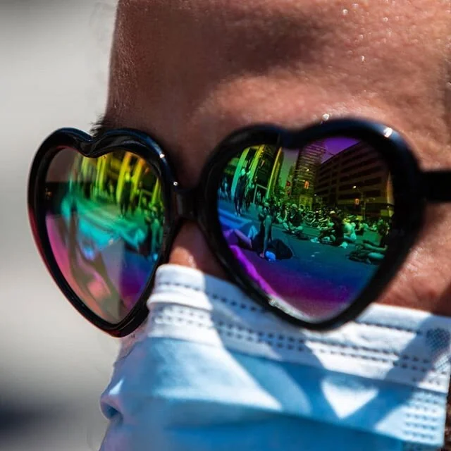 Sit-in participants occupying Bay Street from College to Queen, are reflected in heart shaped sunglasses. The sit-in was led by @notanotherblacklife who focused the Juneteenth event around calls for the Toronto Police service to be abolished. Junetee