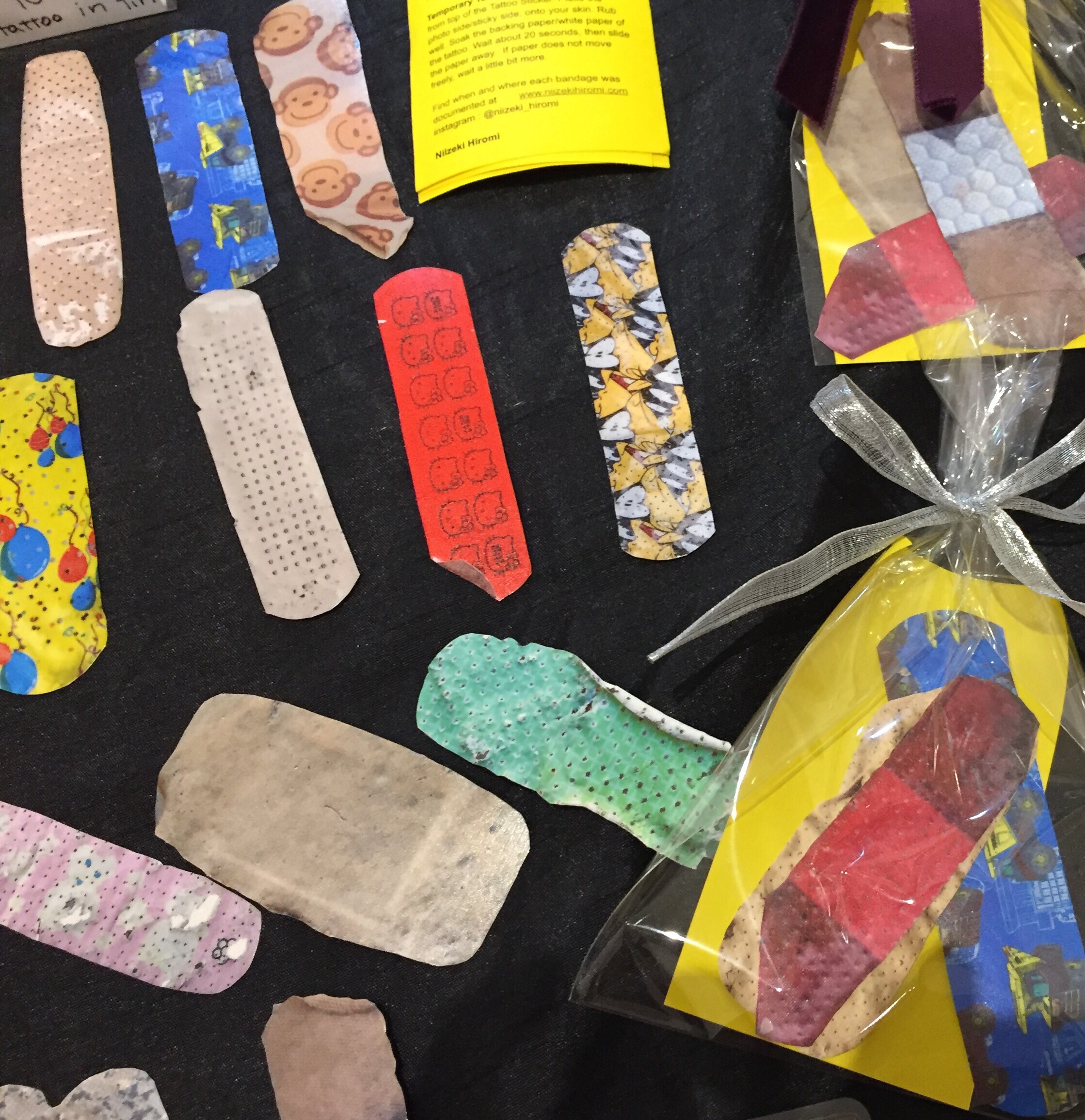 Tattoo Stickers of documented bandages on the streets. by Niizeki Hiromi 道に落ちていた絆創膏の写真で作ったタトゥーシール。『汚い』より、『cute』と言う人の方が多いのに、作家の私が驚いていたり。