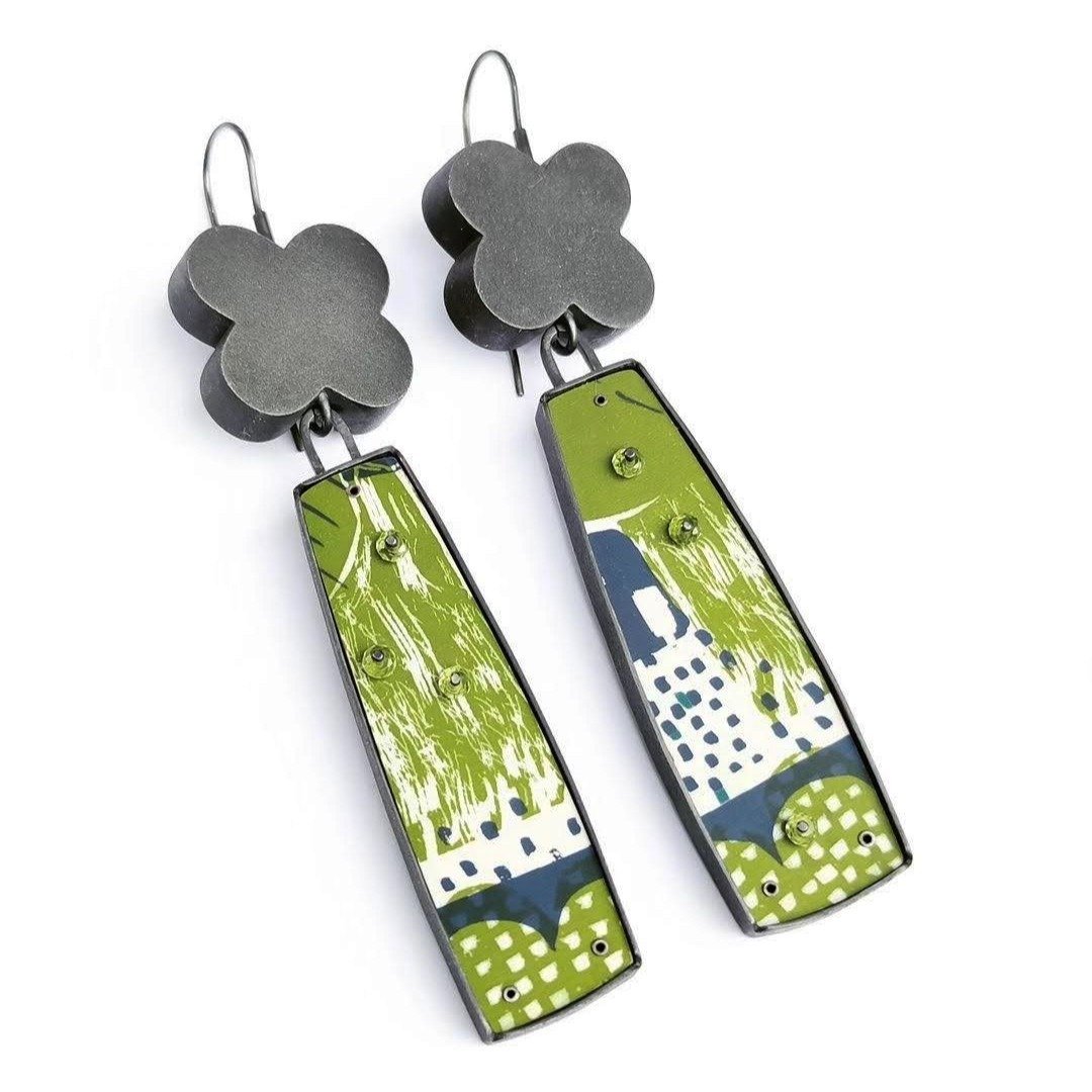 'Garden Party' earrings by guild member Lindsey Mann @lindseymannjewellery 

My jewellery is often inspired by the hazy space that lies between the true and imagined narrative. The latest theme, with botanical influences, stemmed initially from a bun