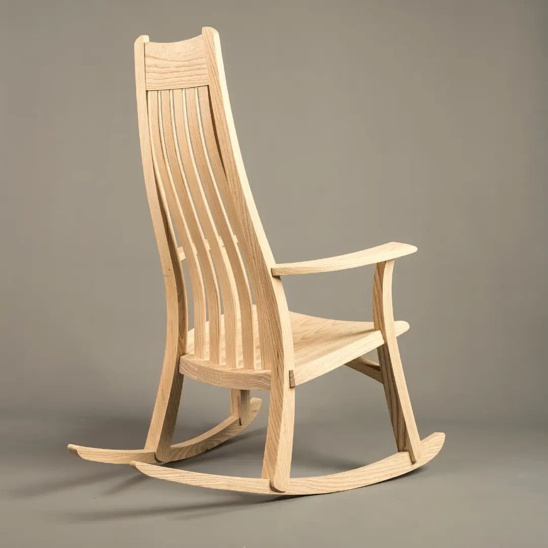 Finally, my 'Bramley' rocking chair, this is number 40. Also in this sequence, a new design. This is my interpretation of a traditional spinning chair, this is in Sycamore. These would have been simple 3 or 4 legged stools with a plank back and been 