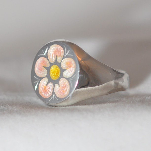 This was a commission - signet rings are quite tricky to do because there isn't much scope for error. This one is sterling silver, hand engraved and then enamelled. I used a clear enamel (flux) and then added a very small touch of pink. 
#hantsberksg