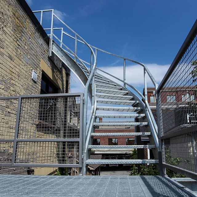 Galvanized curved stair &amp; deck #curvedstaircase #galvanized #customfabrication