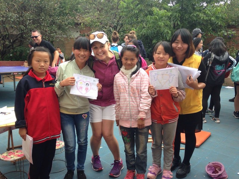  Concordia Shanghai teacher Dagne with students at community center 