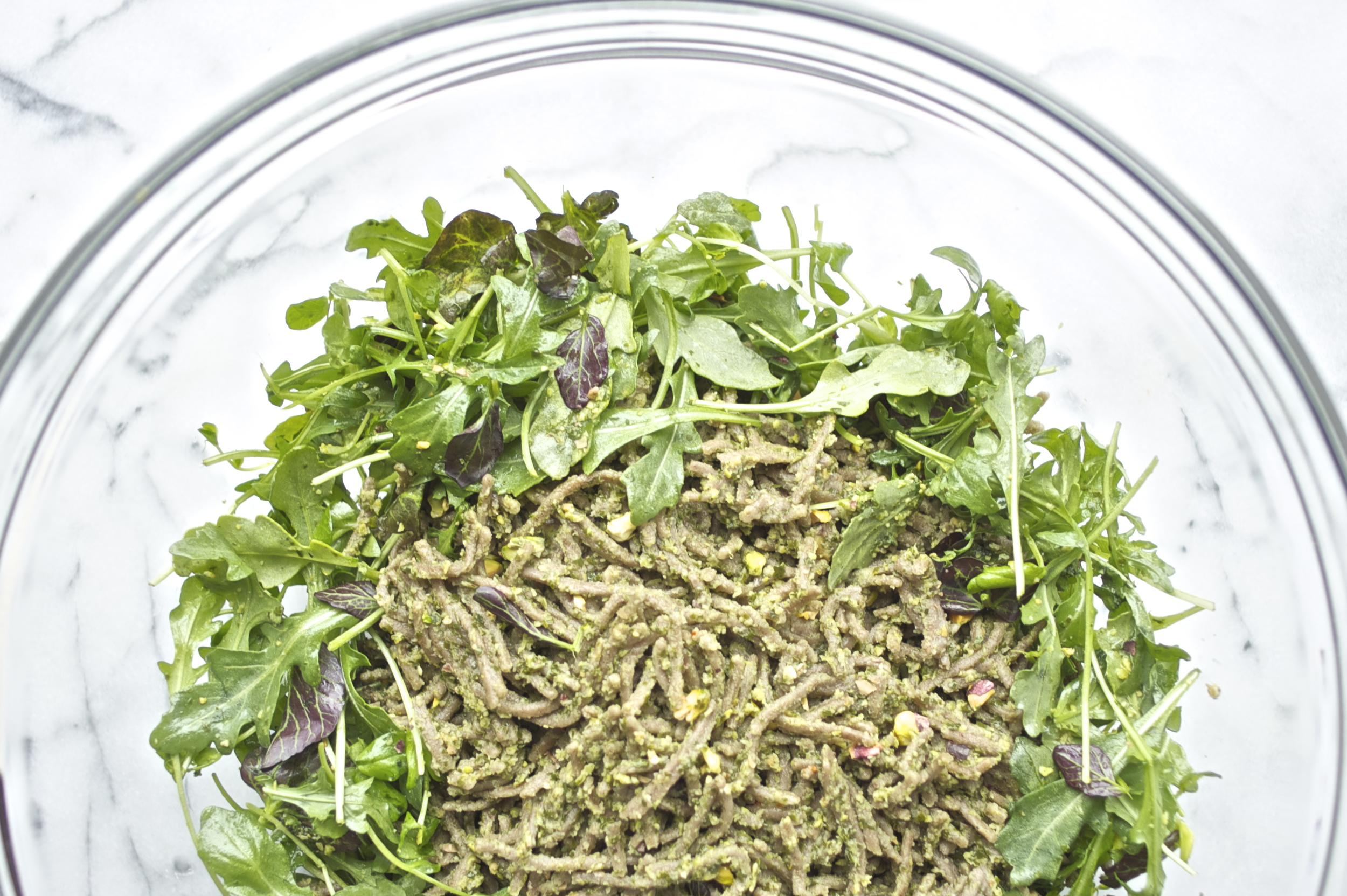 buckwheat soba noodles with dandelion greens pesto