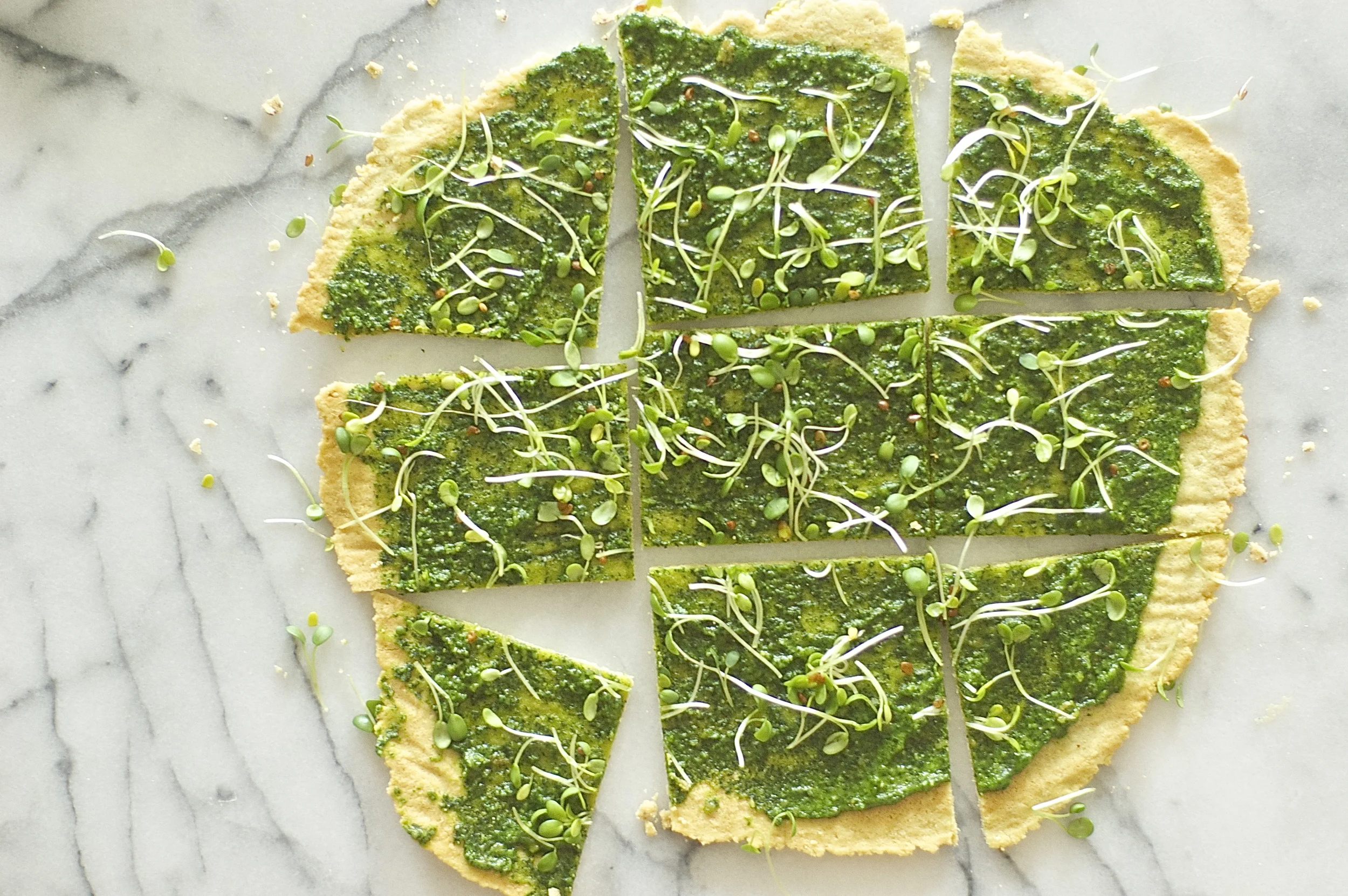garlic flatbread with herb-spinach pesto + sprouts