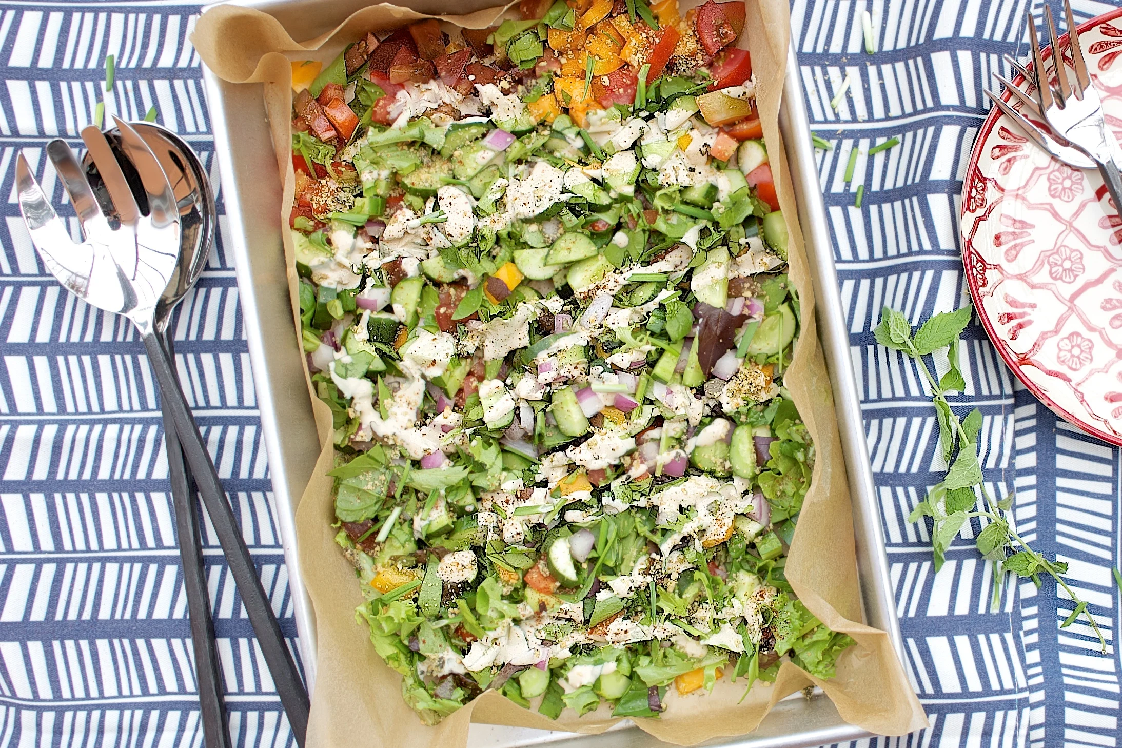 chopped tahini salad w/ crushed pine nuts + mint