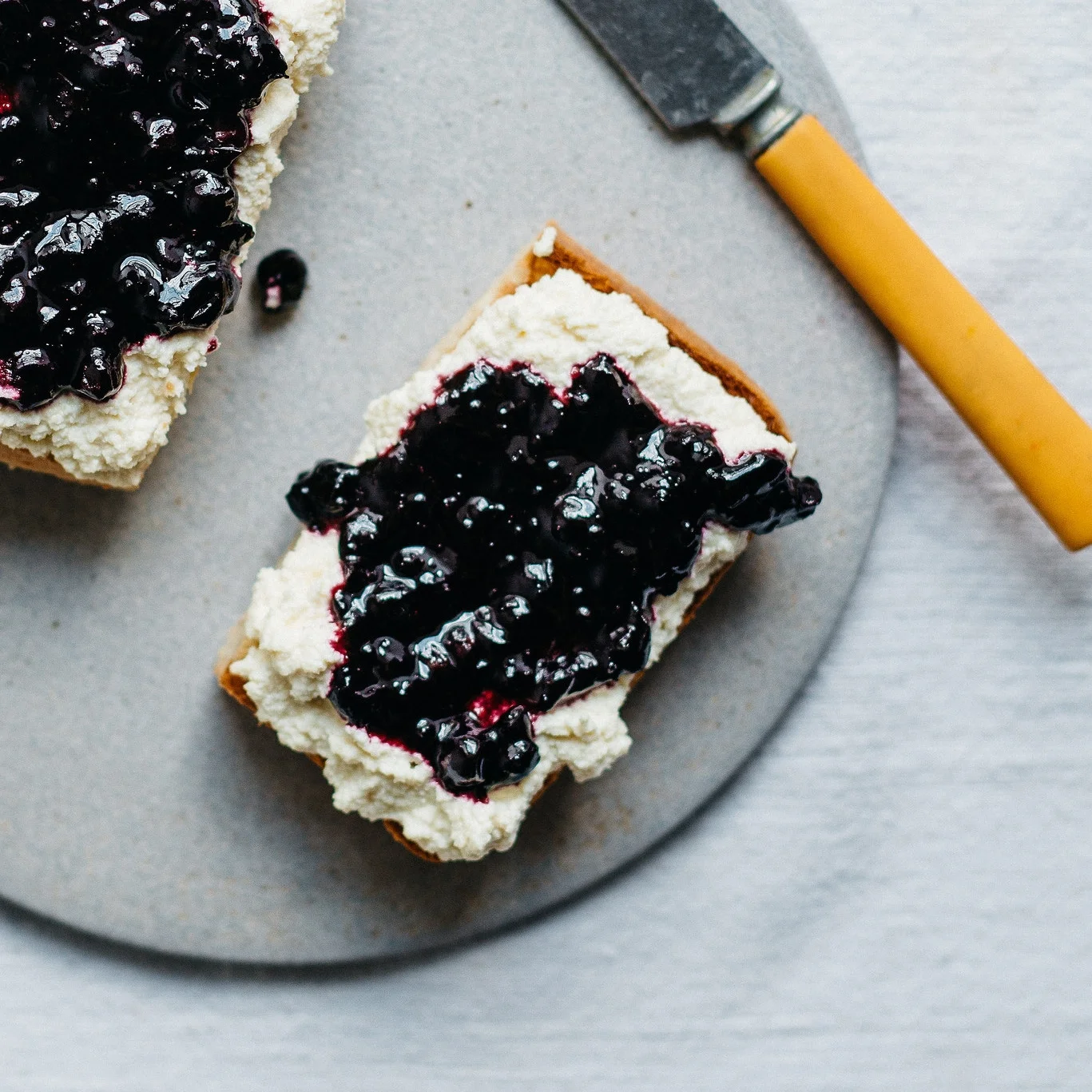 macadamia ricotta &amp; black currant jam on toast