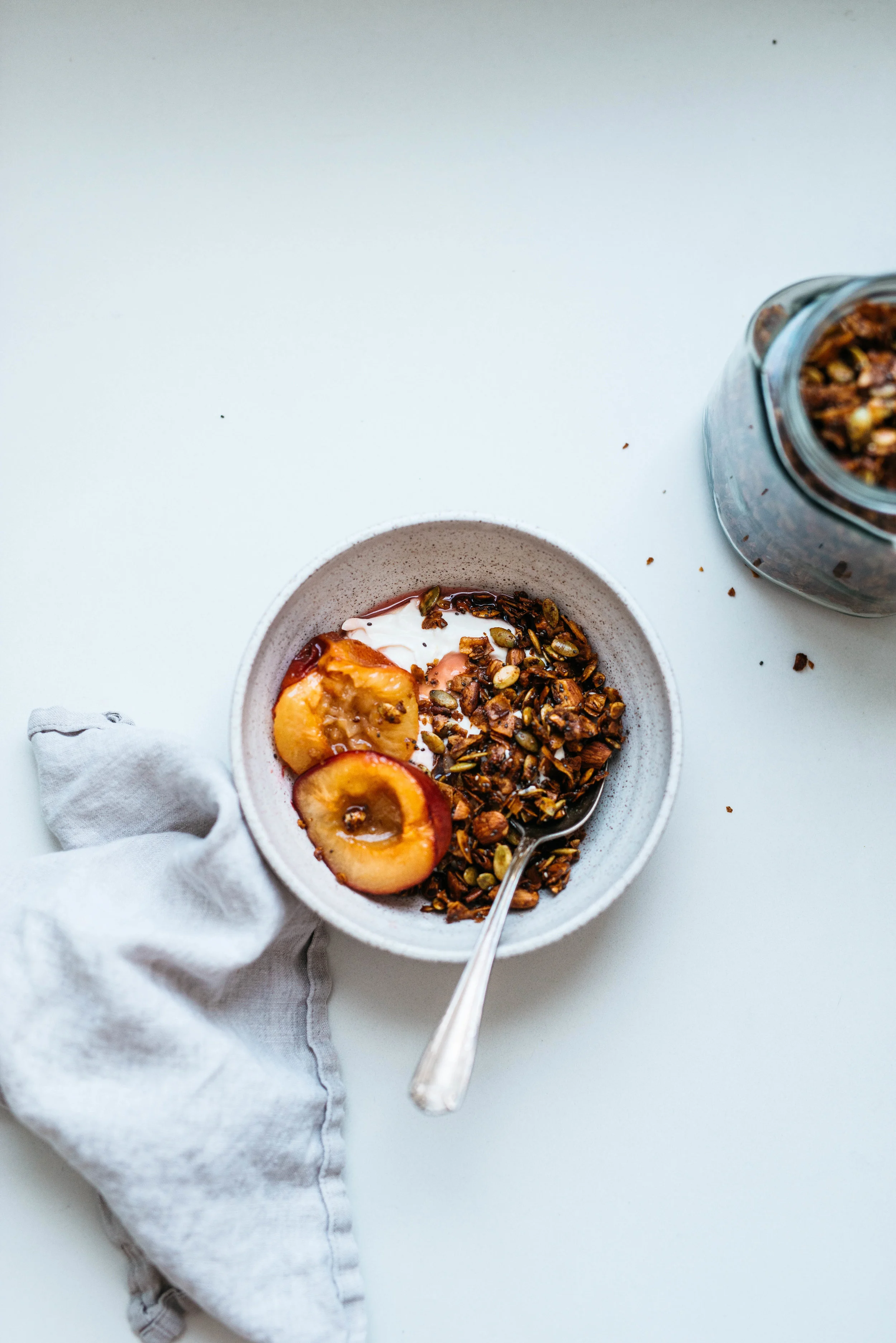 Pepita-Coconut Granola w/ Maple Roasted Plums | Dolly and Oatmeal