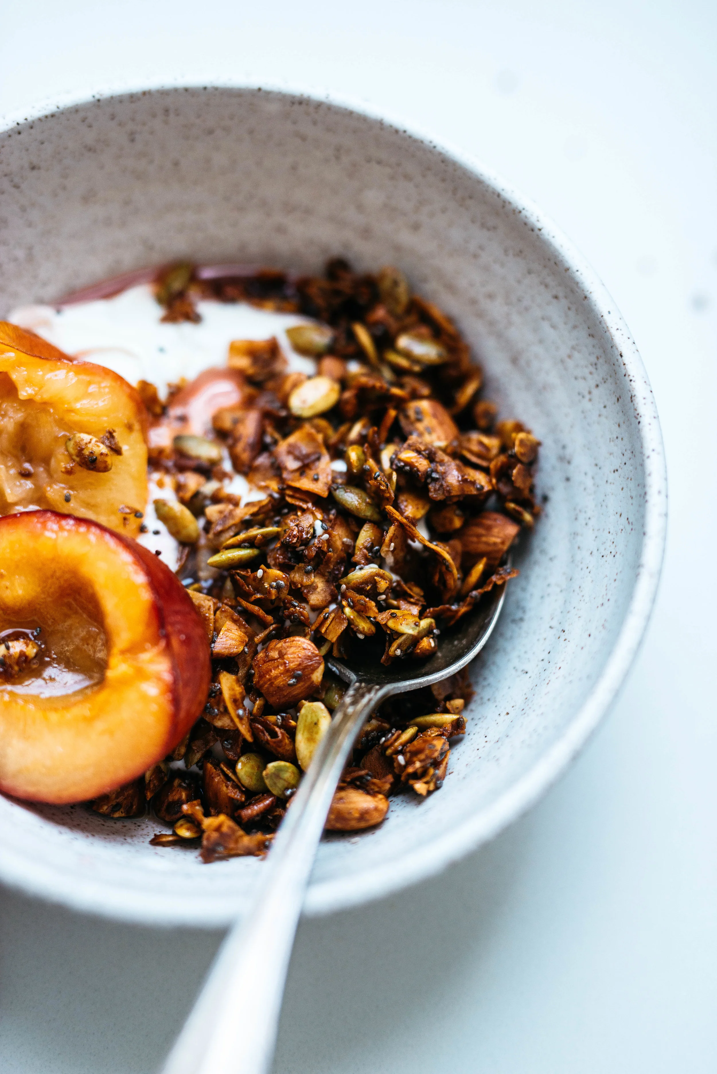Pepita-Coconut Granola w/ Maple Roasted Plums | Dolly and Oatmeal