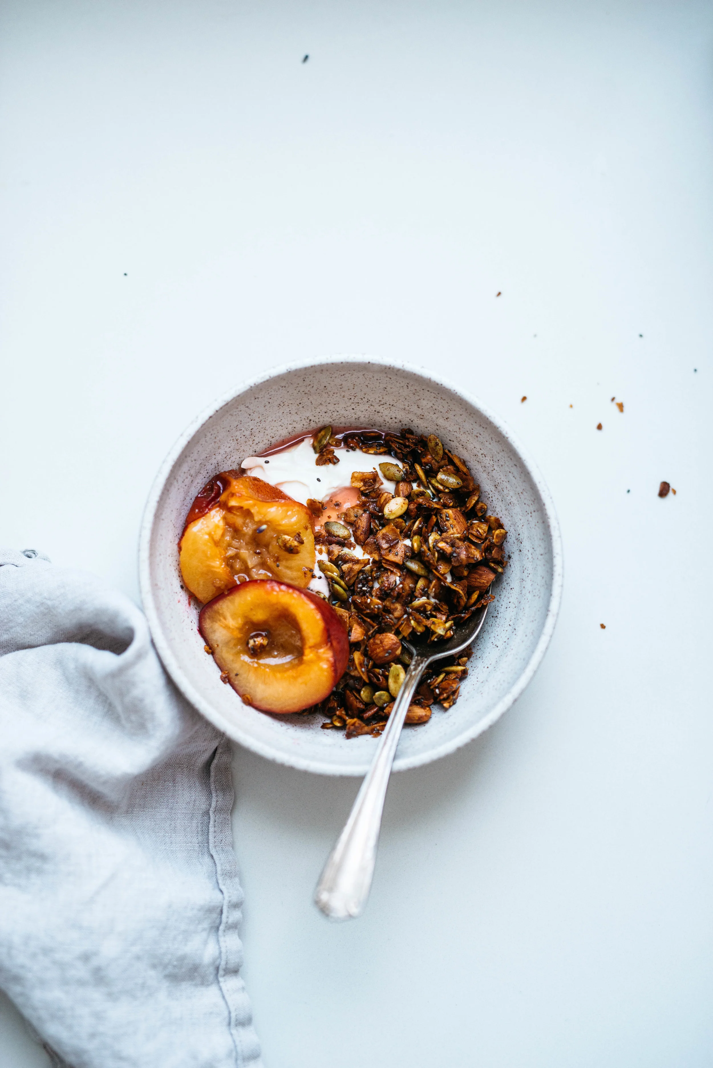 Pepita-Coconut Granola w/ Maple Roasted Plums | Dolly and Oatmeal