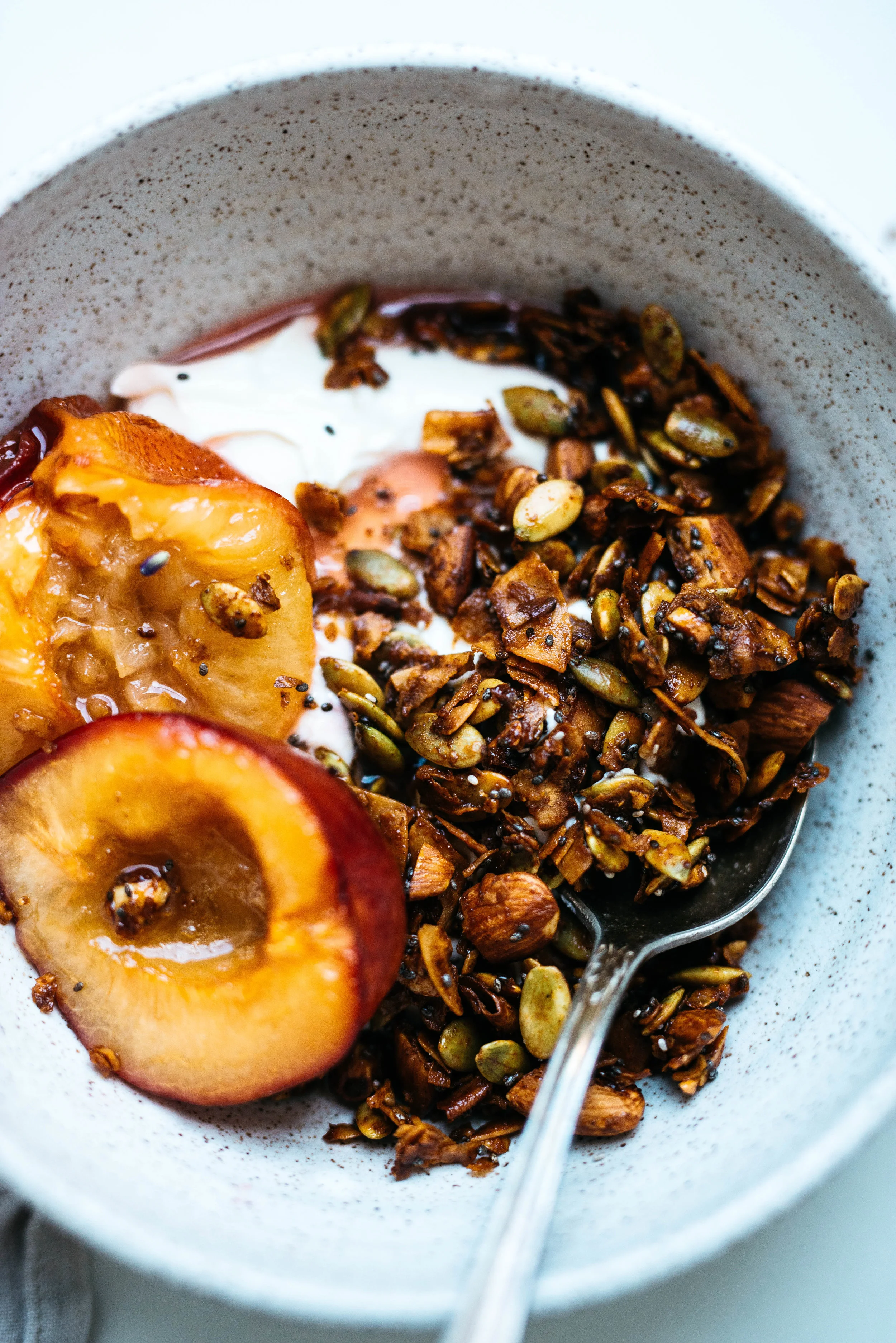 Pepita-Coconut Granola w/ Maple Roasted Plums | Dolly and Oatmeal