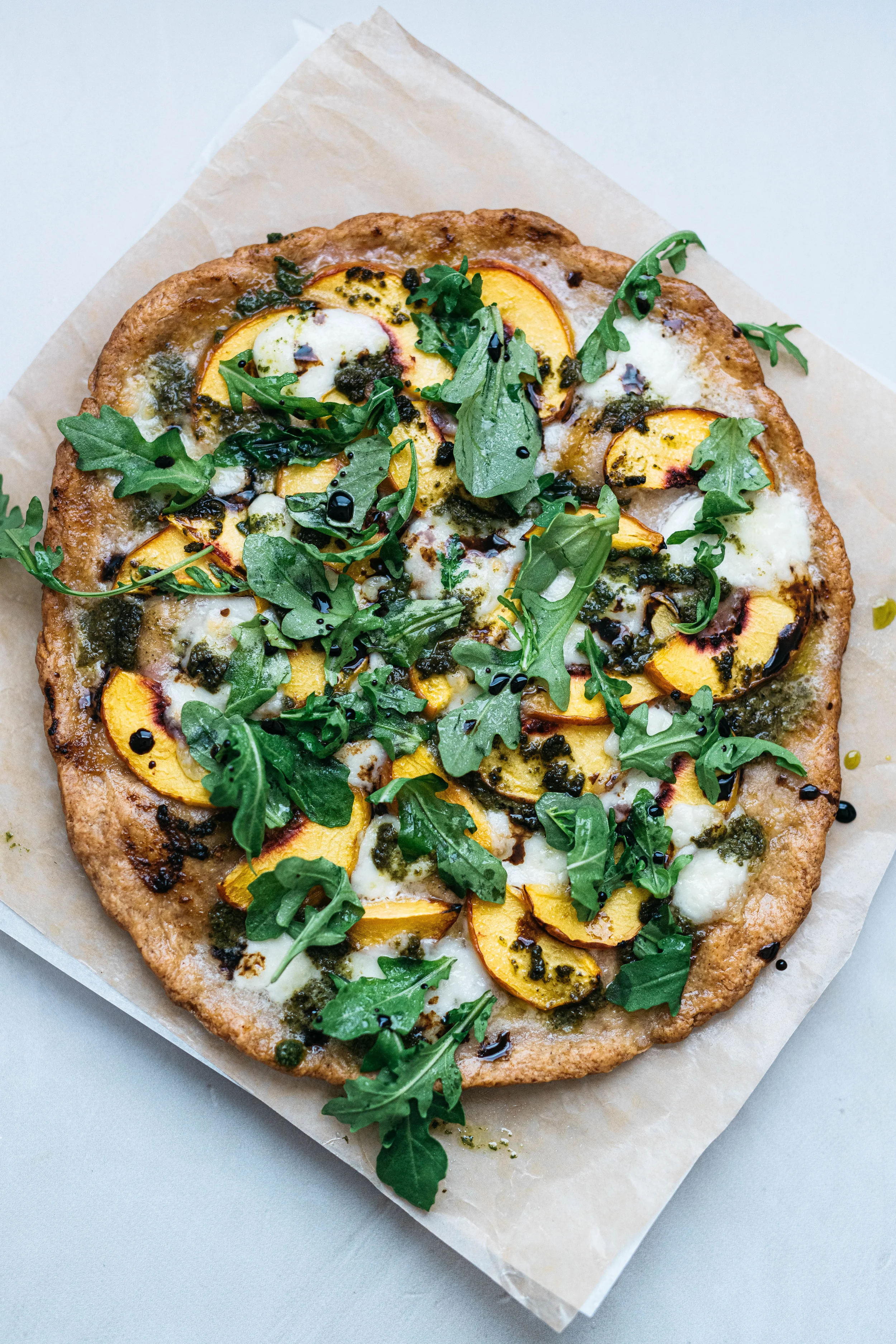 PESTO, BALSAMIC & PEACH PIZZA W/ GARLIC-CASHEW CREAM (GLUTEN FREE)