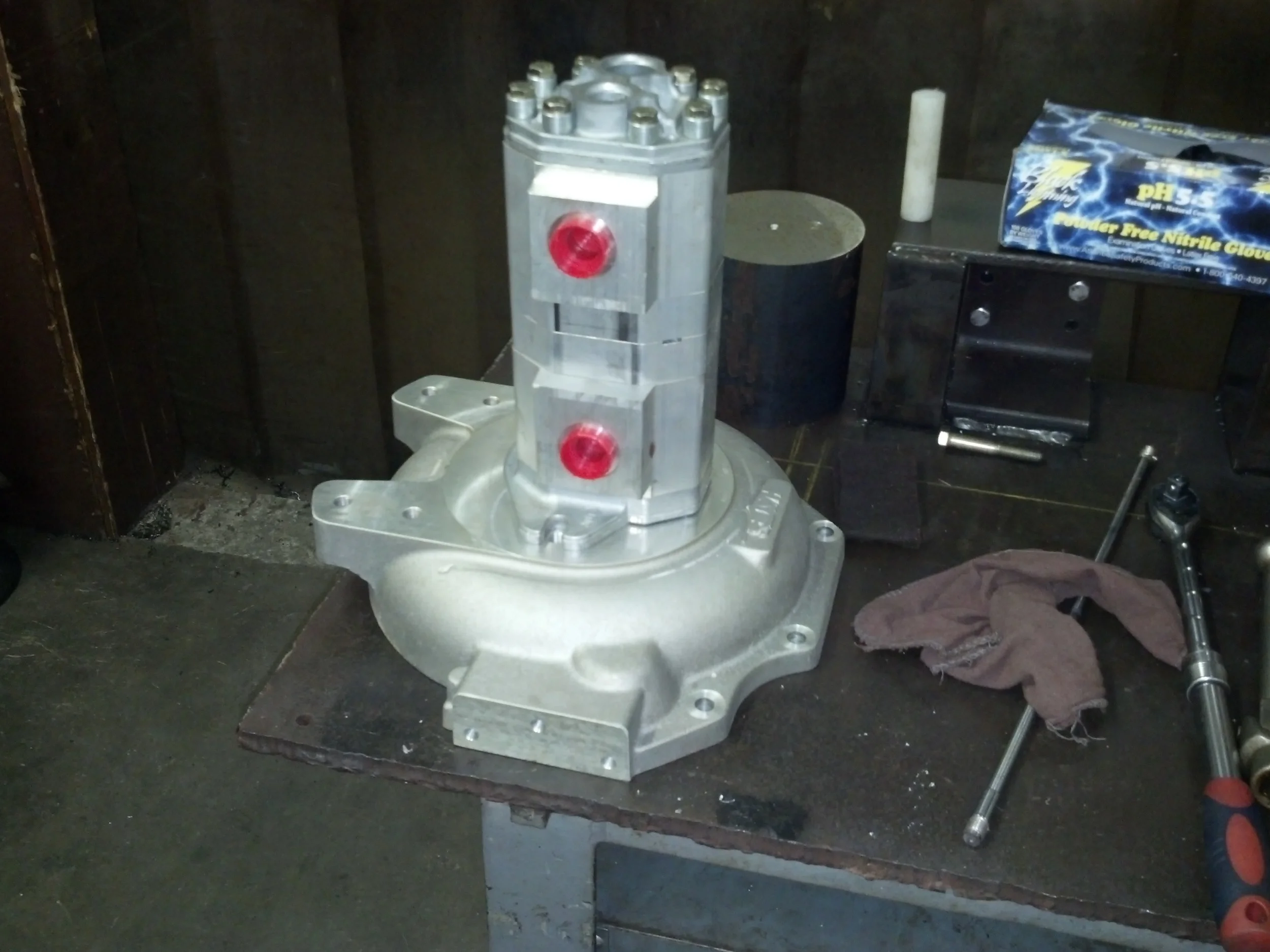 This is the bell housing I purchased then modified to couple to this dual hydraulic pump. One pump drives the hydraulic steering motors via 4 Bosch hydraulic proportioning valves. (This unit has four wheel independent steering.) The other pump drives fork lift, mast traverse, fork tilt and main propulsion motors. 