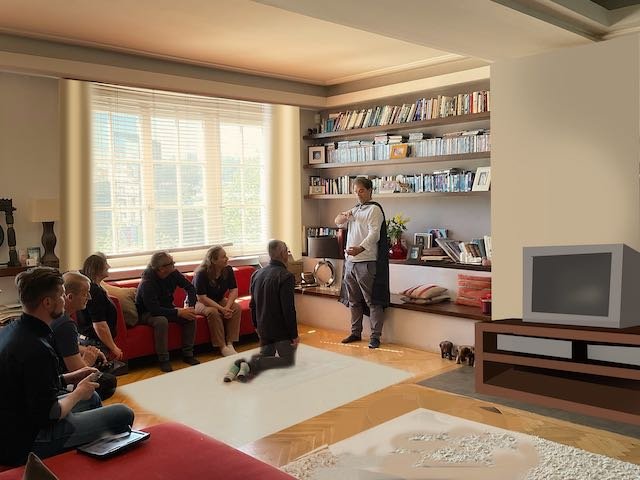 Ta-da! No fireplace. Just a wall with a TV stand and a TV from 1999. And now there are curtains in front of the windows, to soften the room. And an area rug under 7-year-old Maxime to warm up the room and soften his landing when he faints. Click fo