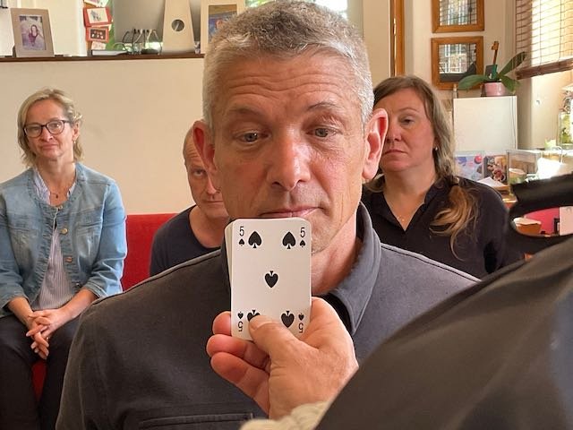 Here’s Michael, as 7-year-old Maxime, one moment before the Magician fans out his deck of cards…