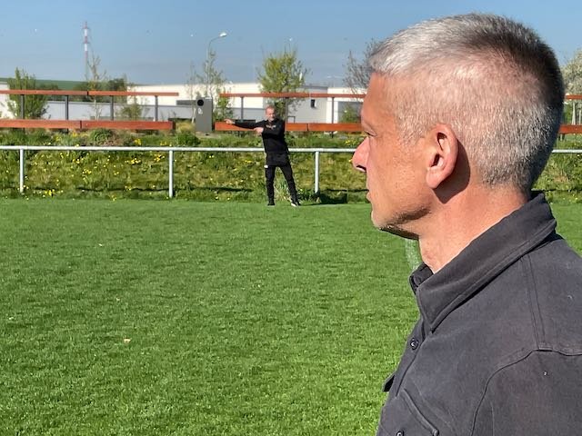 And here’s Maxime’s coach, motioning for him to stop standing still and move the ball down field.