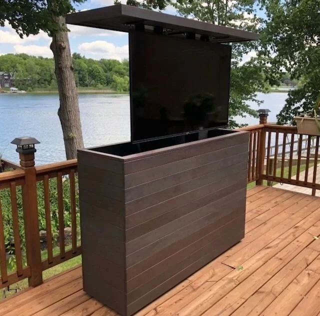  The TV would be in the raised position of an outfoor TV cabinet. Something like this, or the one on the following page… 