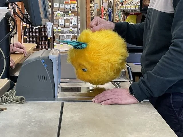  And now BIBERTY, as the CASHIER attempts to scan him. 