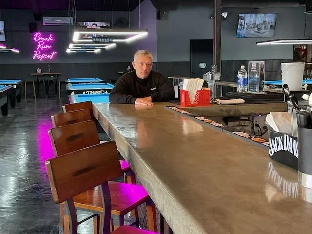  A frame for the Alt. opening, the one where we cut to an OLDER BAR PATRON who says…   BAR PATRON: “What line of work you in, pal?”  