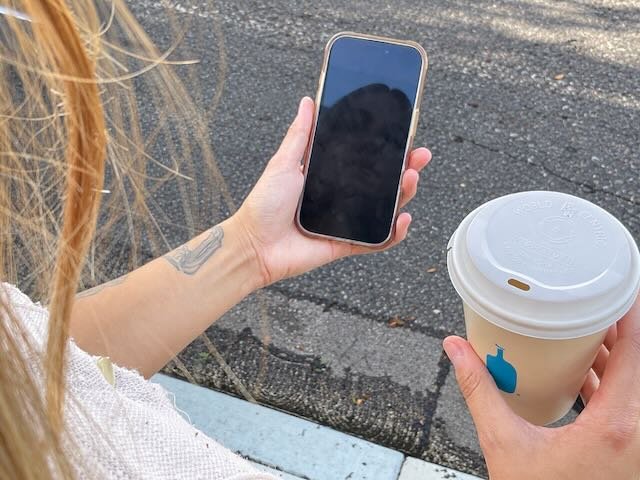  A CLOSE-UP of her requesting a ZOOX. 