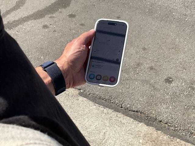  A CLOSE-UP of the GUY requesting a ZOOX. 