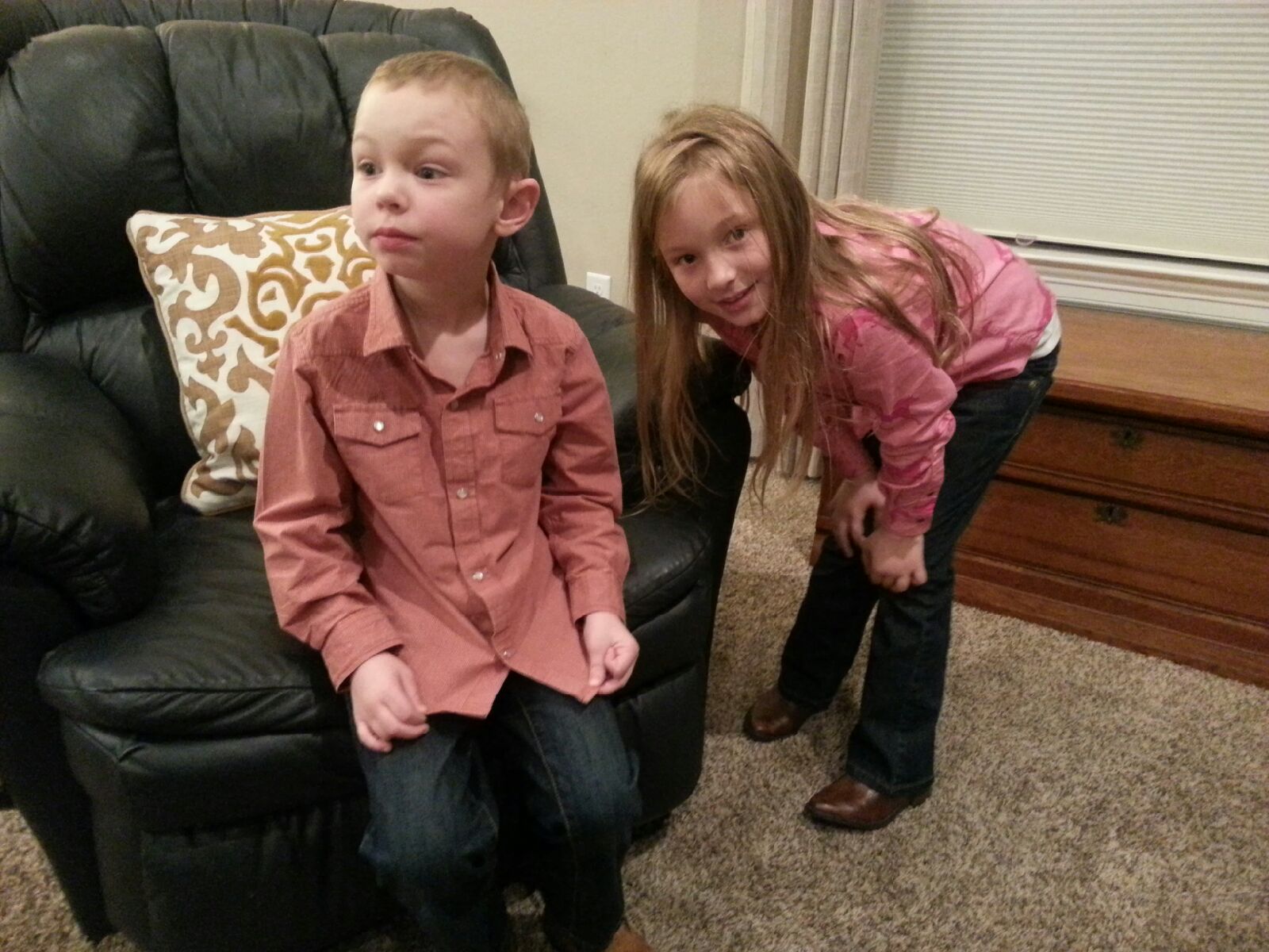 It was "Western Day" at school last week. Ezra was not too sure about his pearl snap shirt, boots, or the camera! Grace tried to cheer him up!