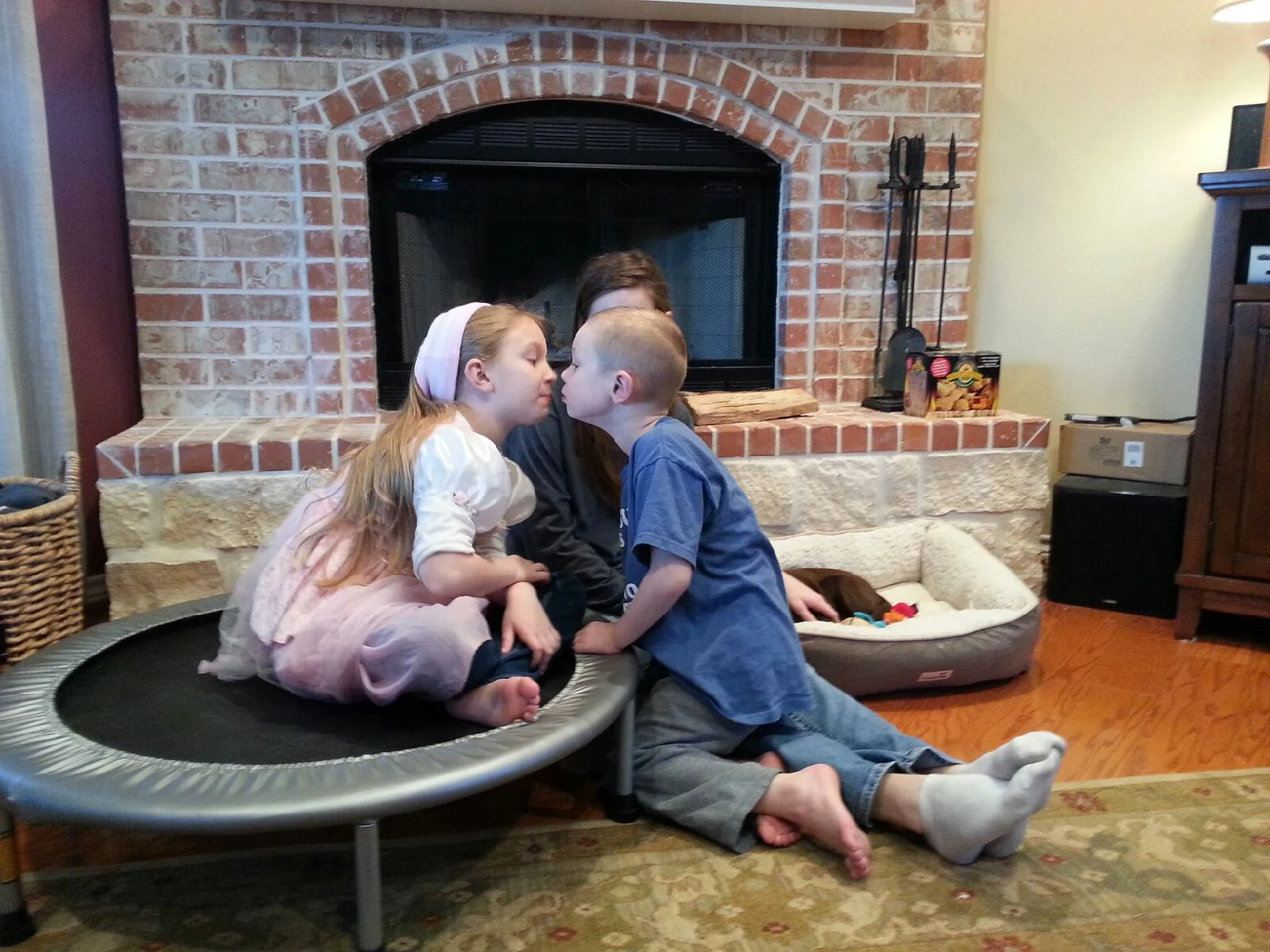 Ezra gave Grace kisses. She was so excited! He has allowed her to kiss him before, but this time he was the one looking for kisses!