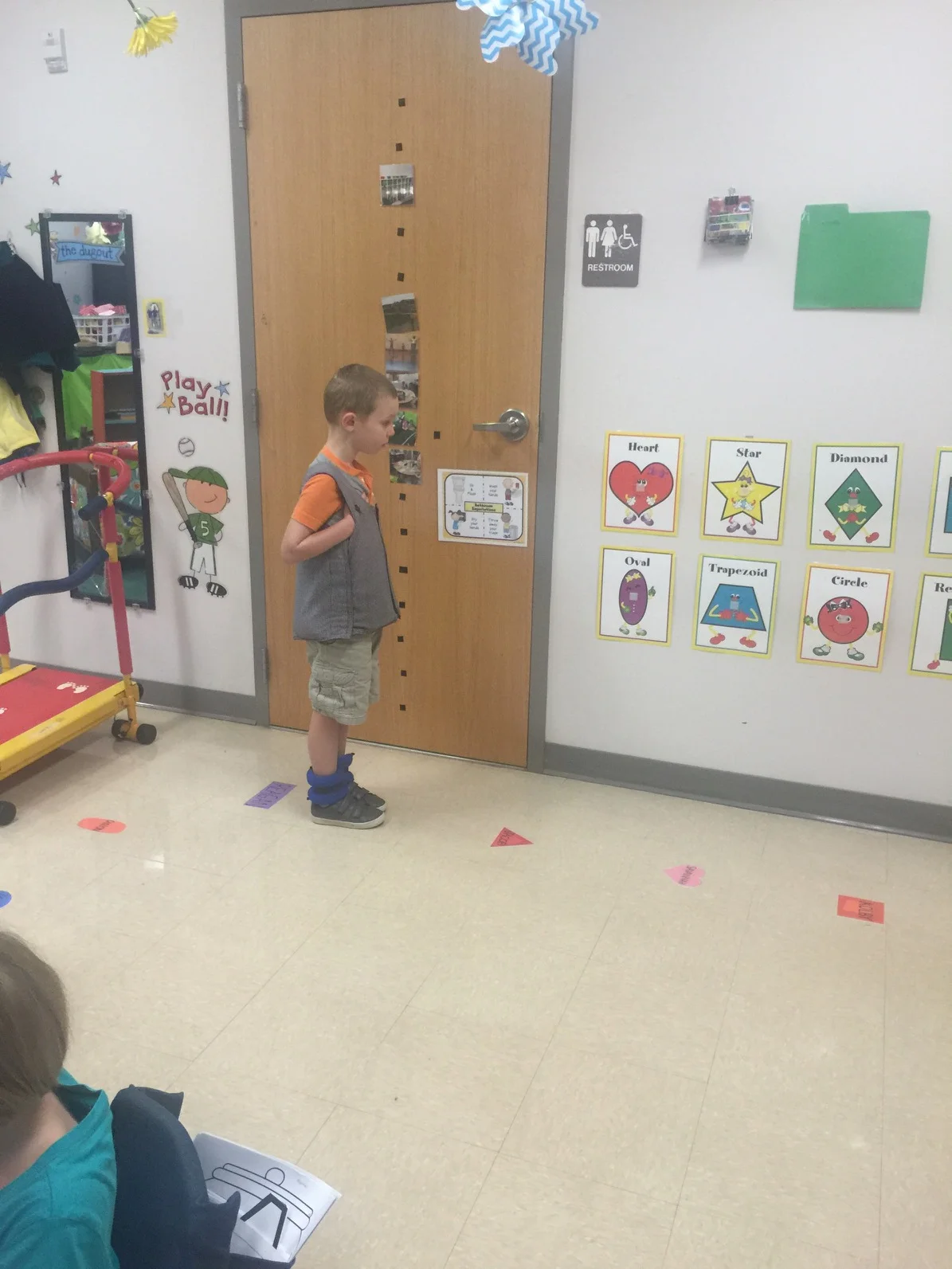 Ezra at school. As I understand it, it was the normally scheduled time for Ezra's class to go outside. Ezra lined up, on his shape, all on his own because he is super smart like that. I can just imagine him thinking "Don't they realize what time it is!? They are going to make me late!"