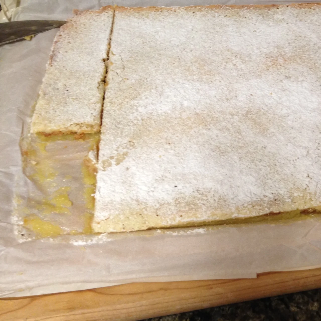 I cut off a few squares to try. Uh oh. I could see, as I feared, the lemon filling seeped through the crust.