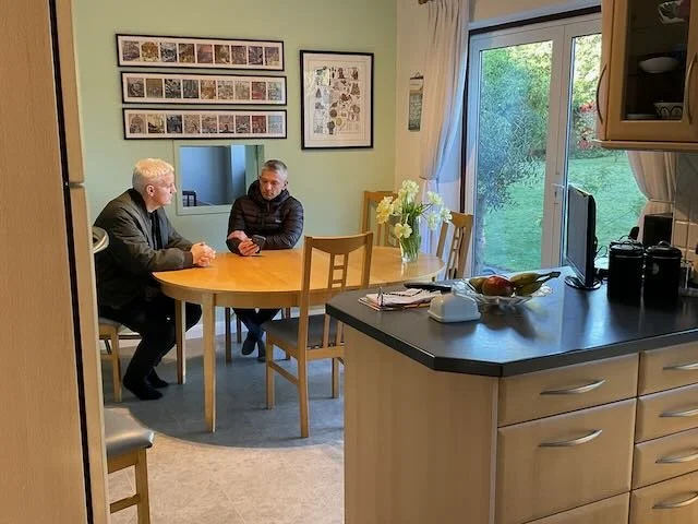  And now… JOSH’S MUM and DAD, seated at the kitchen table in our reco kitchen,  159 ALBANY , where MUM is letting DAD know they need to send their son a little cash. 