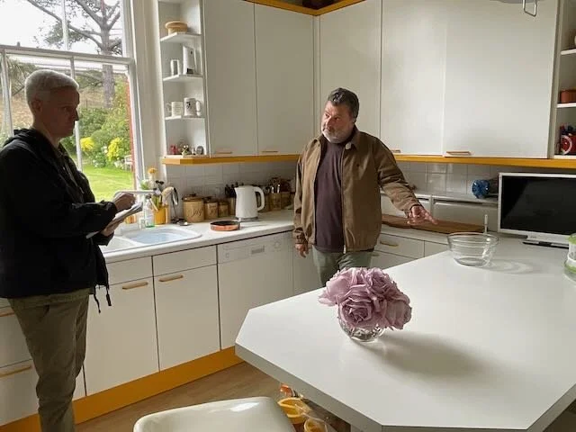  CUT…to the LAB-COATED FOLKS now in the KITCHEN.   Tech 1:  “Skillet.”    ‍  TECH 2 makes the  CHECK!  sound with a pen and clipboard.   Tech 1:  “Vacuum.”  (Which he quickly turns on and off.) 