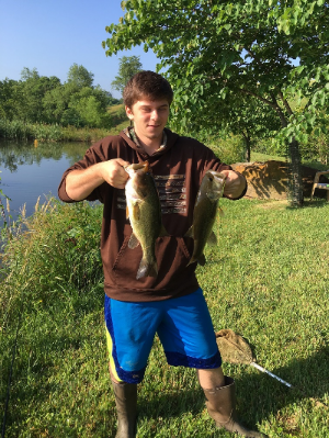 Sam catches bass at farm pond