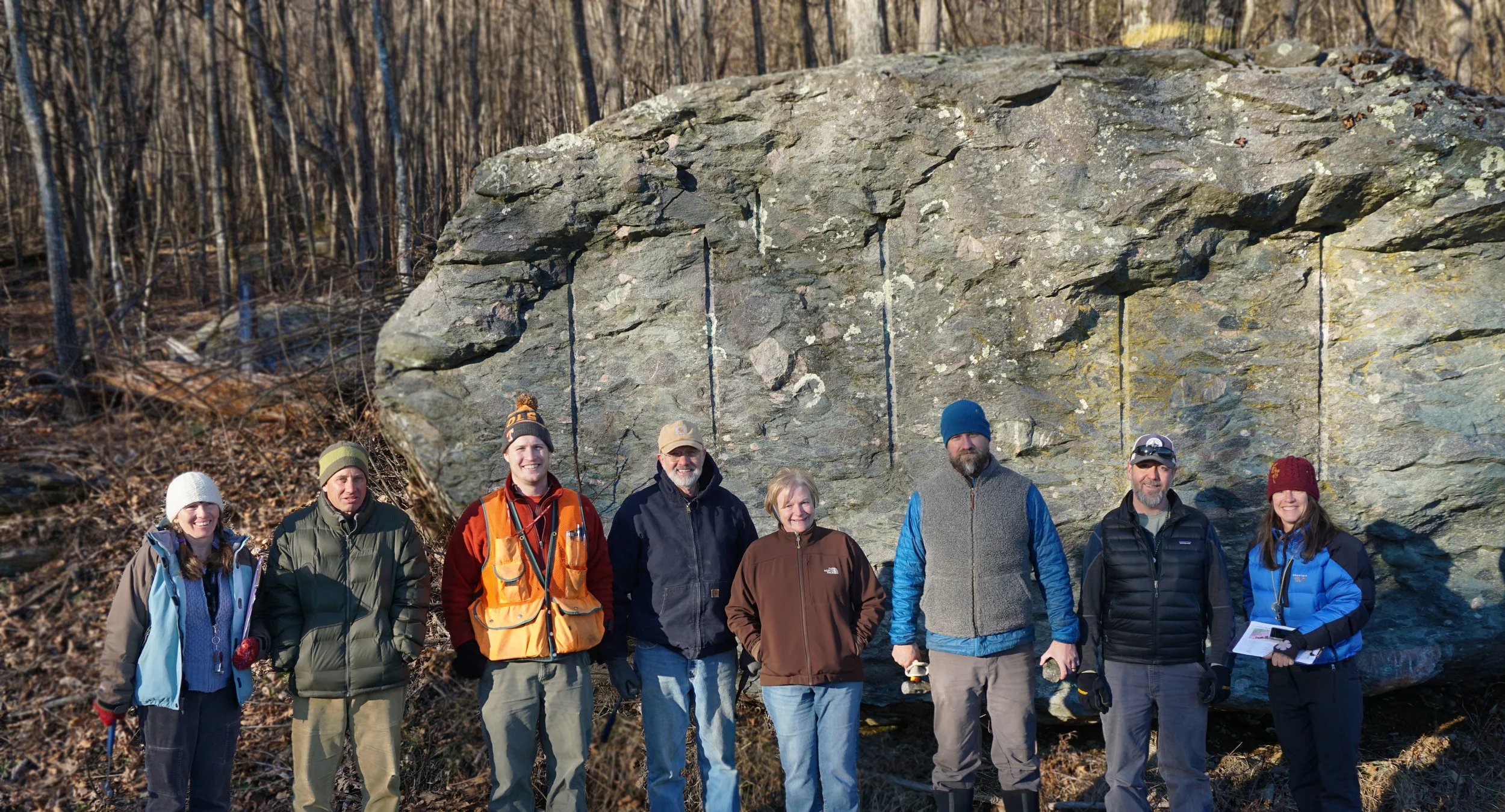 The 2019 Geology Expedition group in front of boulder conglomerate, still smiling!