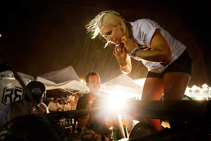  Sam Richard attempts to retrieve her racing gear out of the car when the rain starts to come down after the race.&nbsp; 