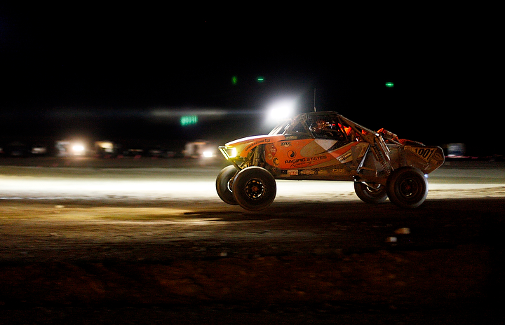  A race vehicle blazes through a straightaway on the infield of its final lap.&nbsp; 