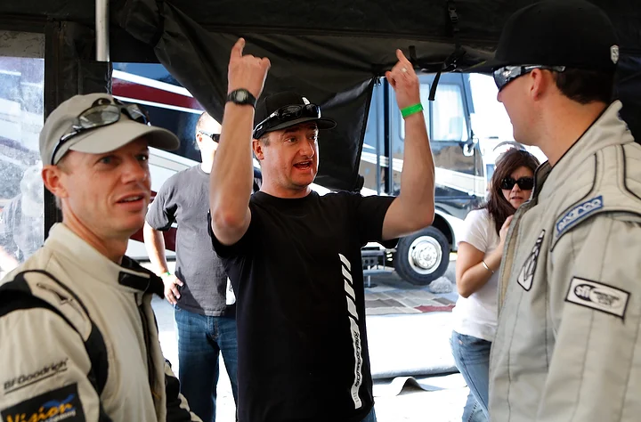  Harvey Knapp, team manager, tells the drivers about how he was screaming at the team helicopter to fly higher off the ground to avoid a disqualification for the #68 team. 