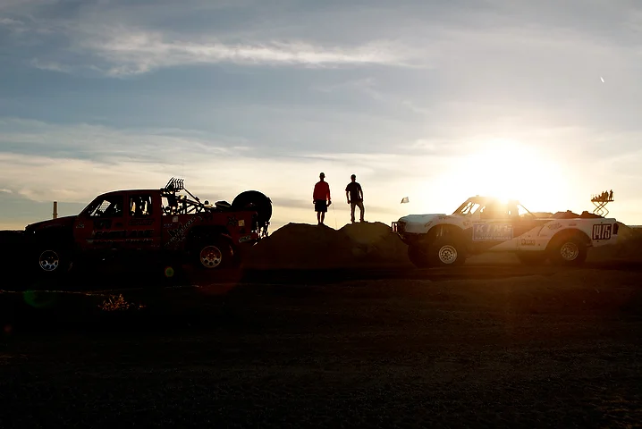  Team members stand on a hill and watch the end of the race.&nbsp; 