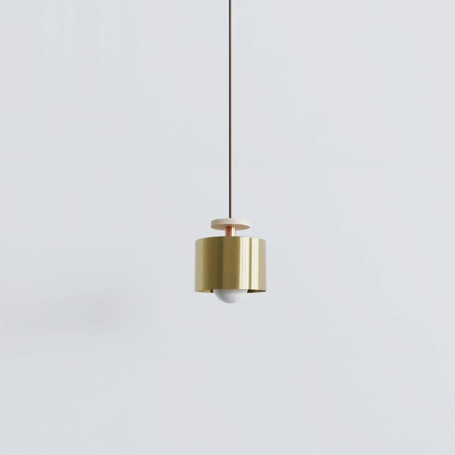 Spun pendant in brushed brass shade with brass stem.