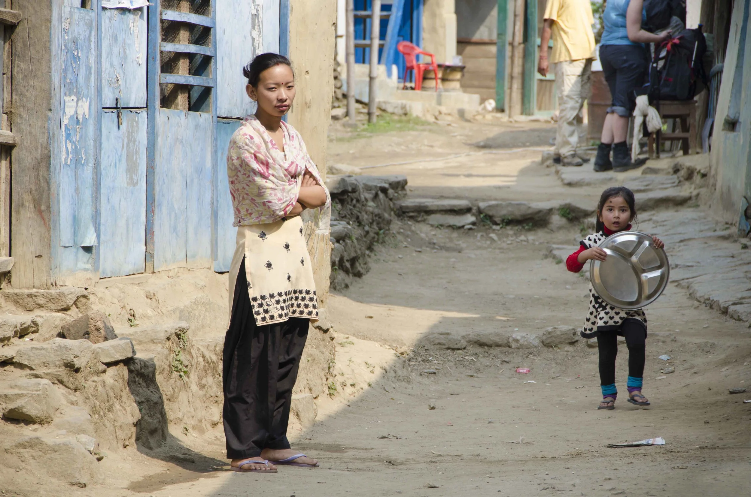Woman and child in village on Eastern section of Annapurna circuit.