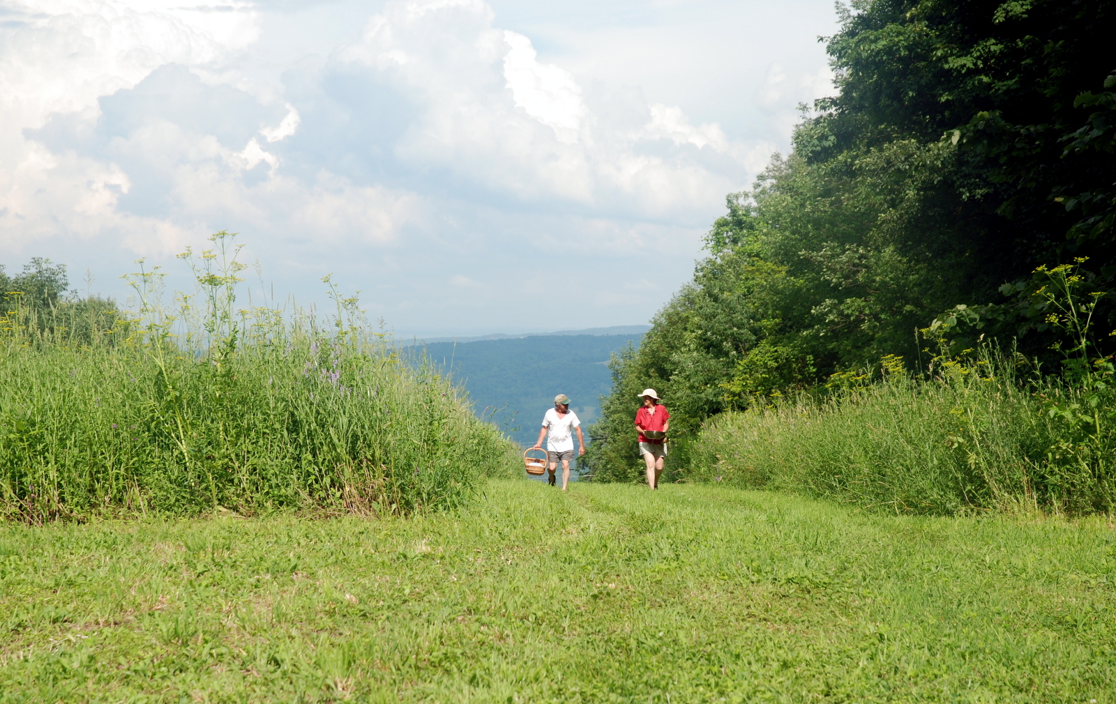 Bob and Fran coming up the hill with goodies