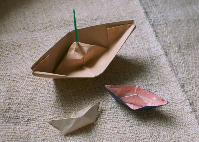 Actual Papa-made paper boats. And, yes, one of them is made from a lottery ticket.