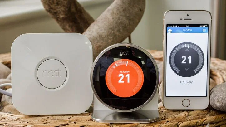 The Nest Thermostat, with receiver and App on portable smart device