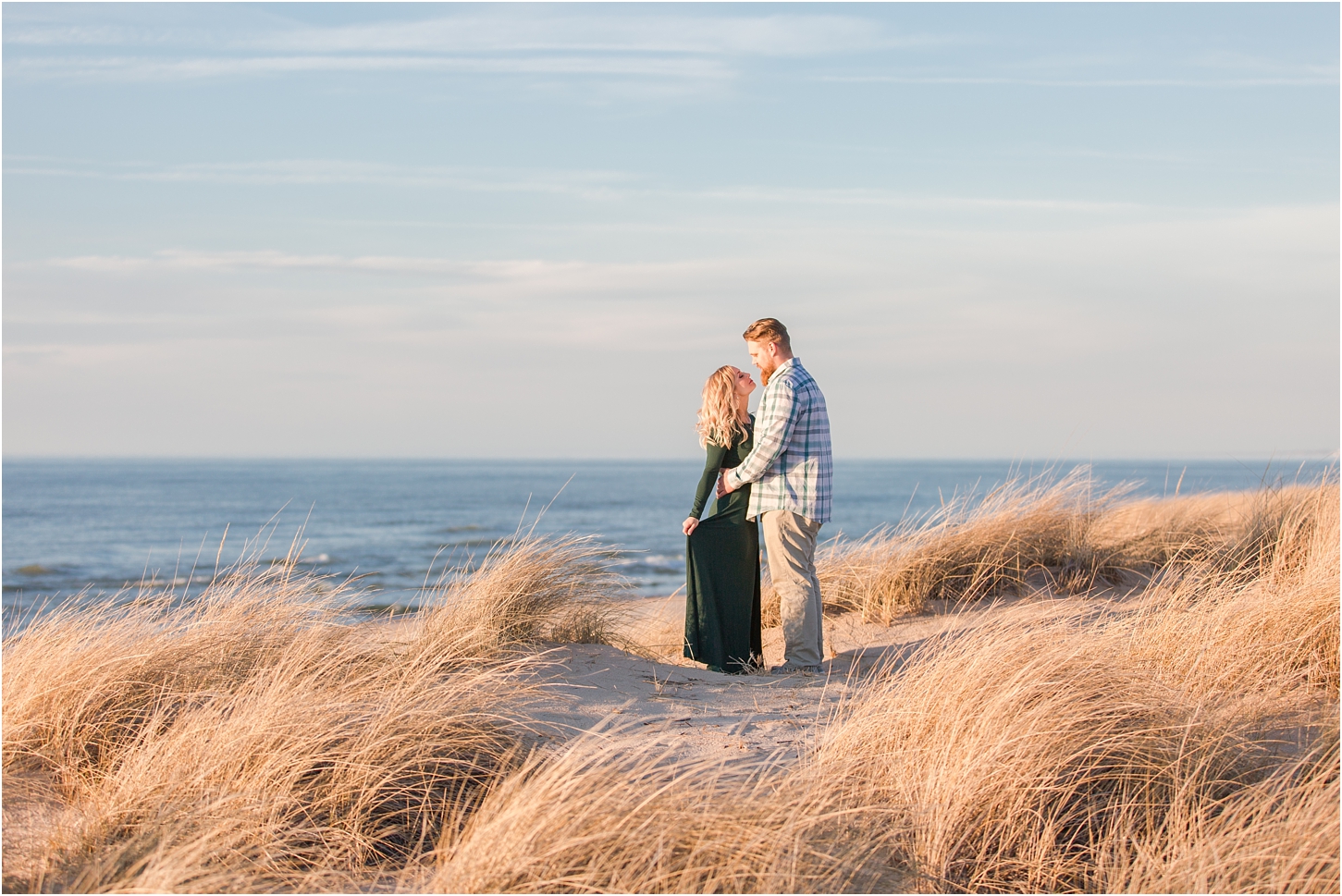 romantic-sunset-beach-engagement-photos-at-silver-beach-in-saint-joseph-mi-by-courtney-carolyn-photography_0001.jpg