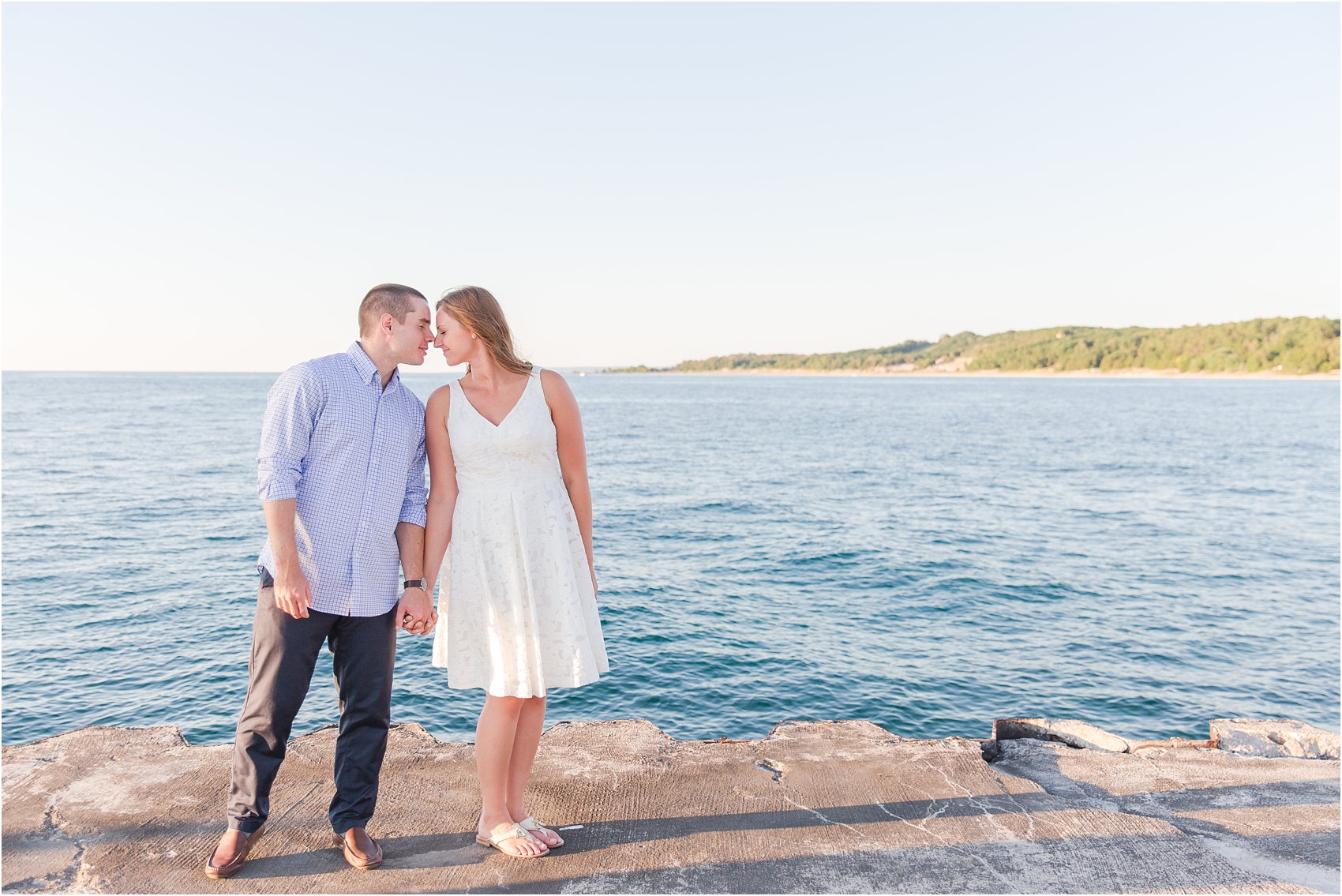 romantic-sunset-engagement-photos-at-the-lighthouse-in-charlevoix-mi-by-courtney-carolyn-photography_0009.jpg