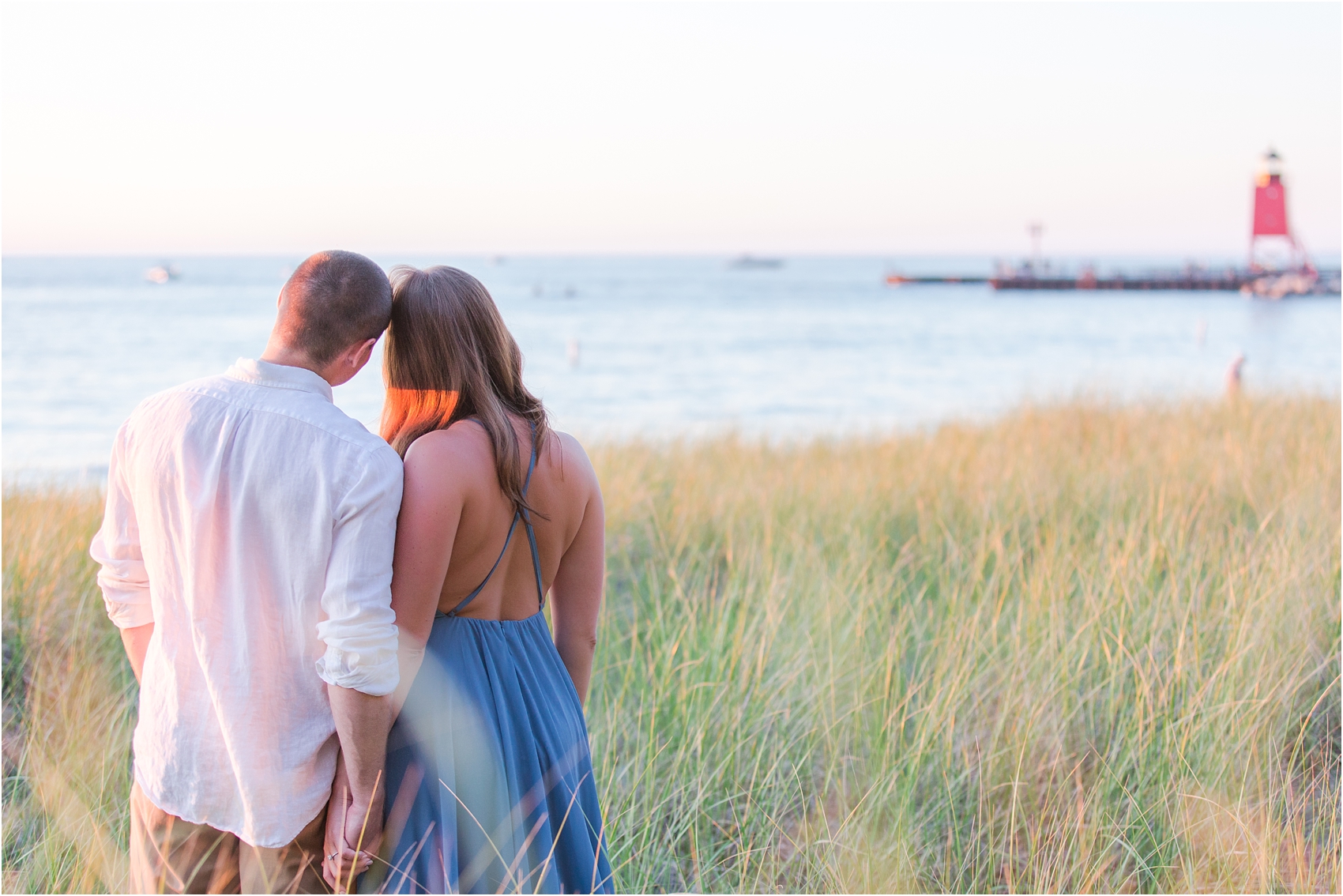 romantic-sunset-engagement-photos-at-michigan-beach-park-in-charlevoix-mi-by-courtney-carolyn-photography_0014.jpg