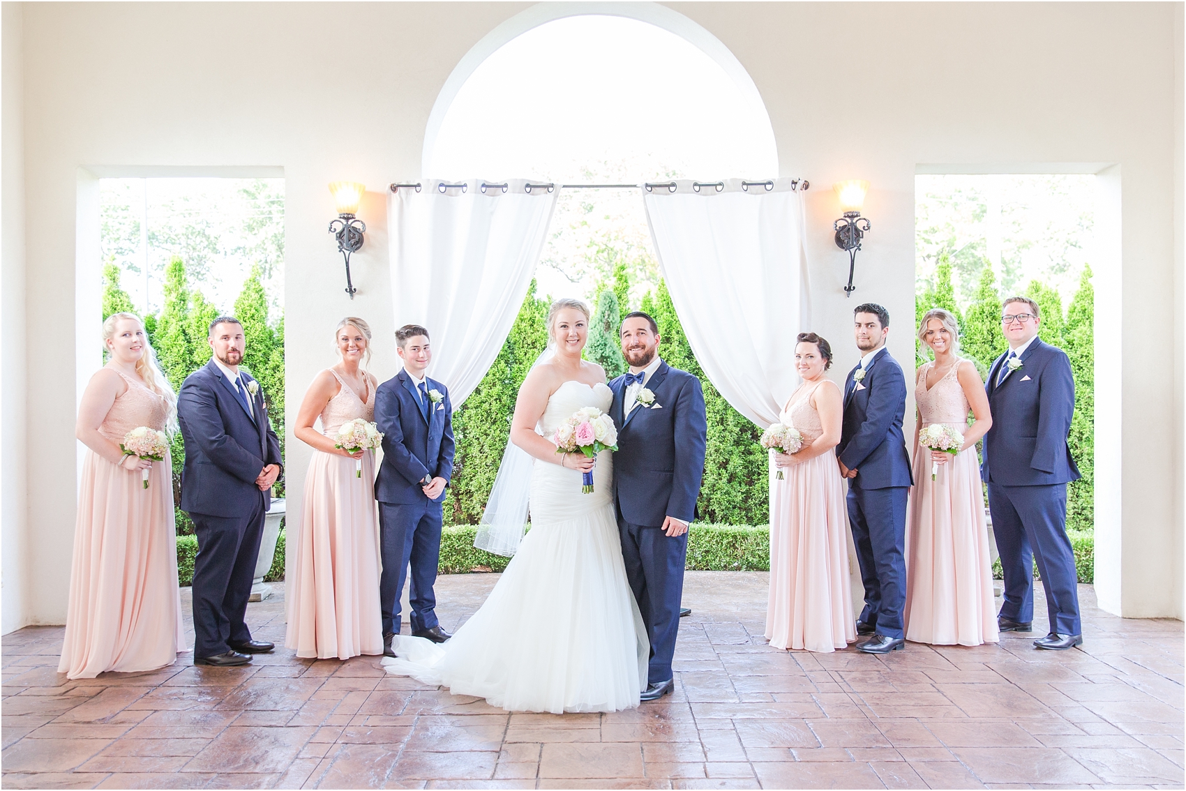 joyful-and-candid-navy-blush-wedding-photos-at-crystal-gardens-in-howell-mi-by-courtney-carolyn-photography_0066.jpg