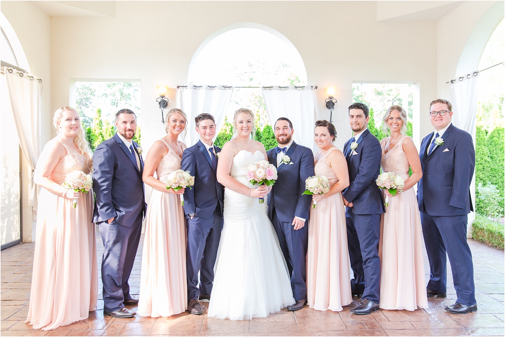 joyful-and-candid-navy-blush-wedding-photos-at-crystal-gardens-in-howell-mi-by-courtney-carolyn-photography_0070.jpg