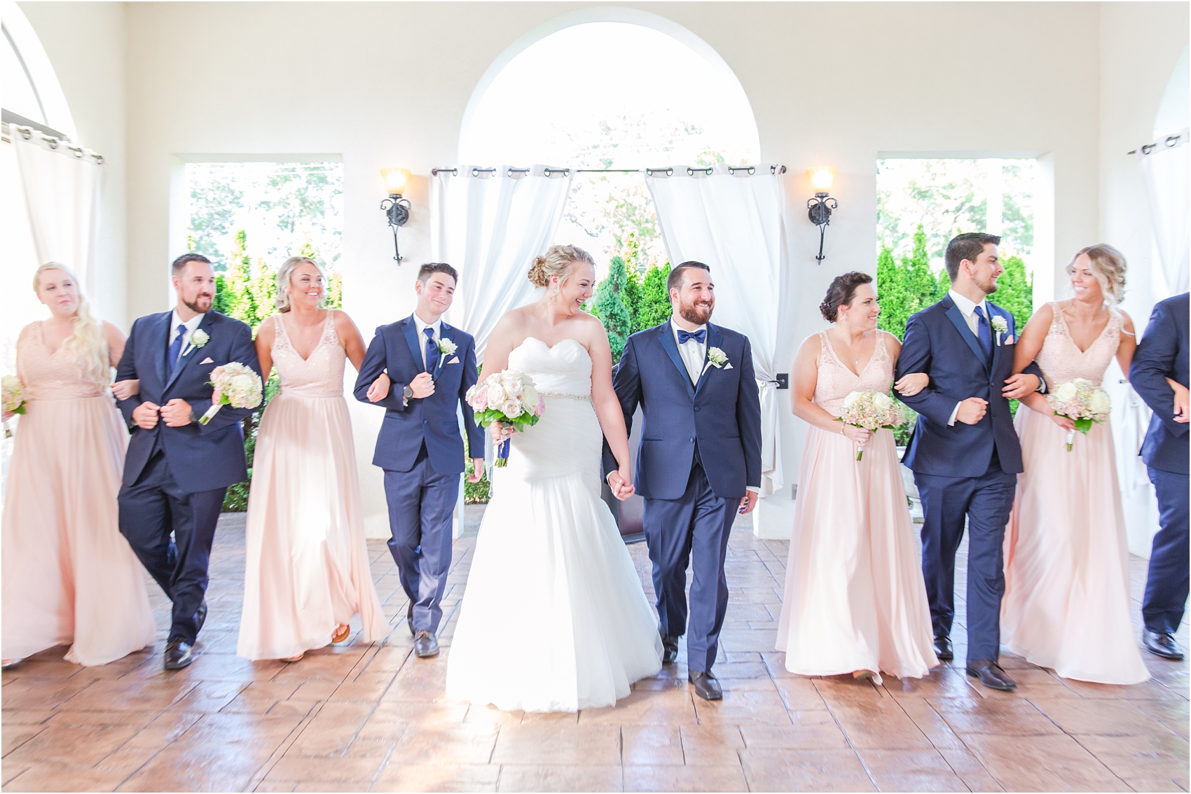joyful-and-candid-navy-blush-wedding-photos-at-crystal-gardens-in-howell-mi-by-courtney-carolyn-photography_0074.jpg
