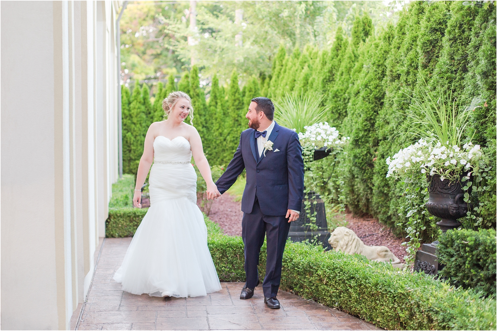 joyful-and-candid-navy-blush-wedding-photos-at-crystal-gardens-in-howell-mi-by-courtney-carolyn-photography_0093.jpg
