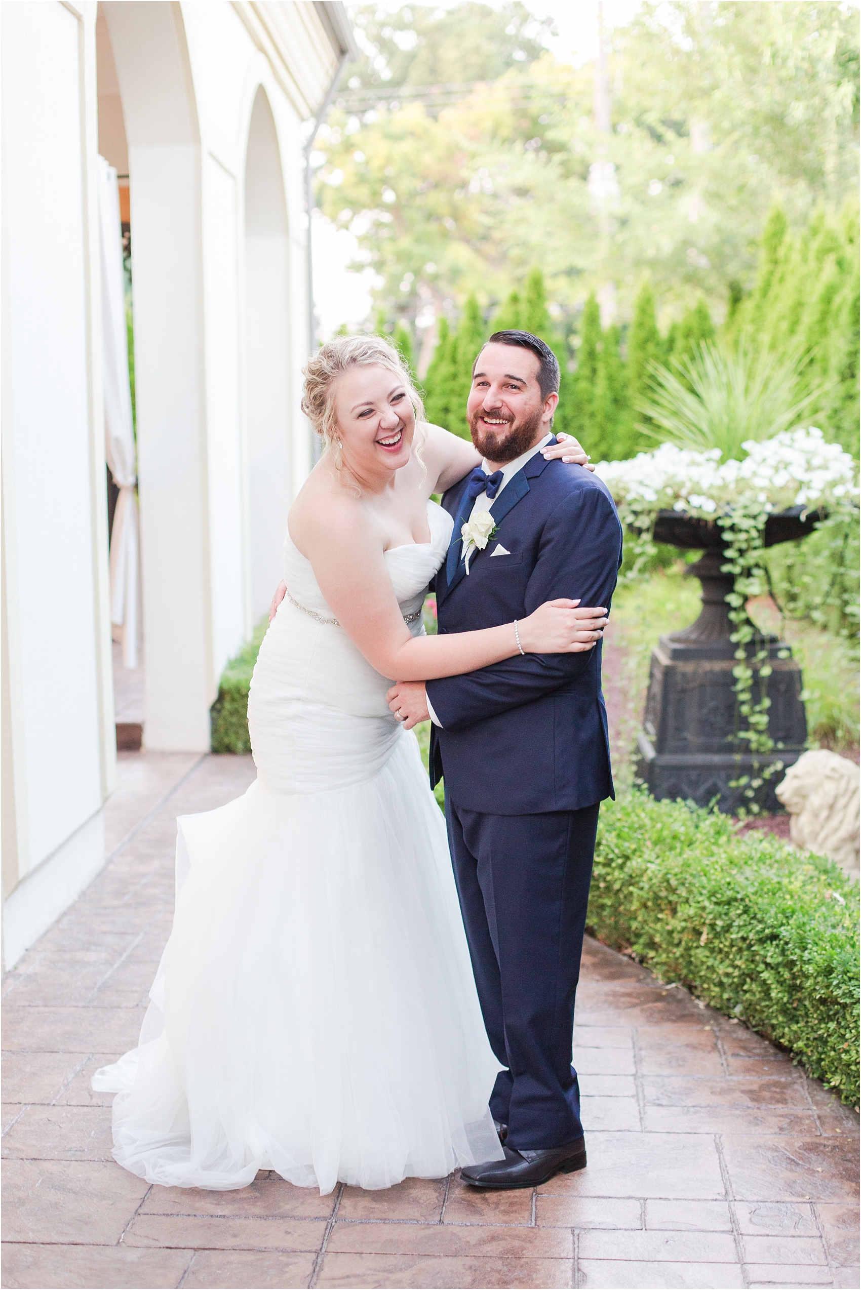 joyful-and-candid-navy-blush-wedding-photos-at-crystal-gardens-in-howell-mi-by-courtney-carolyn-photography_0099.jpg